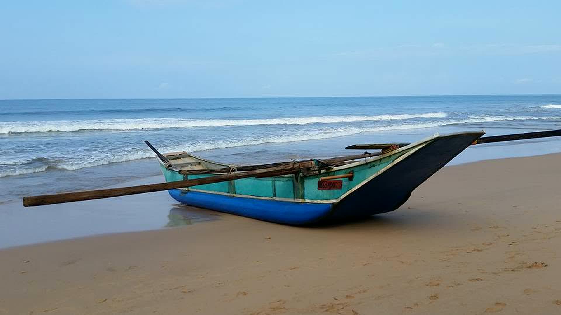 Traditional outrigger boat on the beach