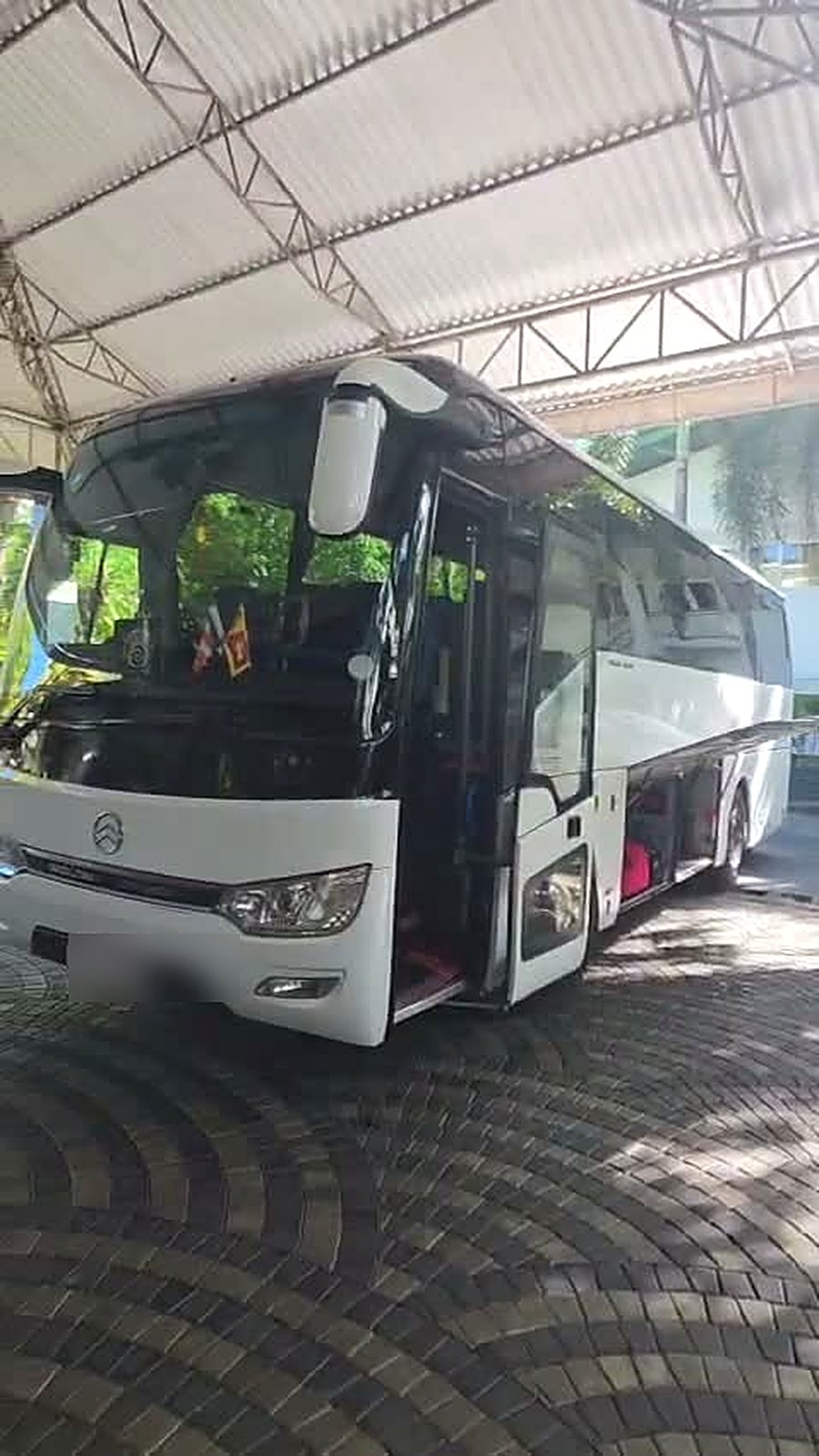 Coach waiting at the hotel entrance